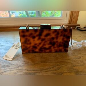 7.5” x 4.5” brown and black urban expressions vegan clutch
